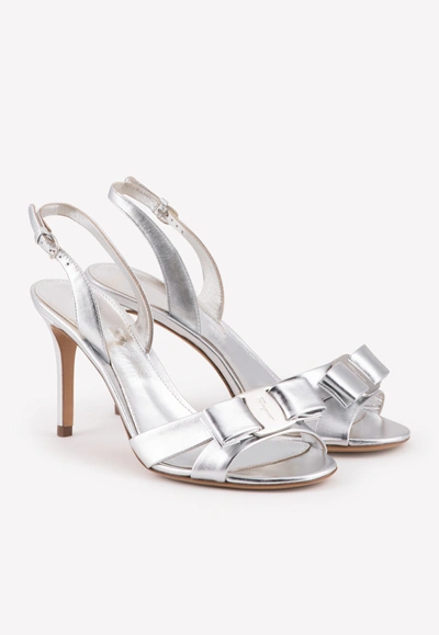Shop Ferragamo Lida 80 Vara Bow Sandals In Metallic Leather In Silver