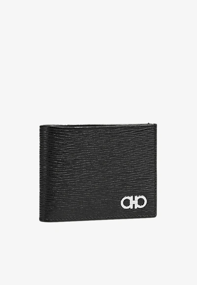 Shop Ferragamo Revival Gancini Bi-fold Calfskin Wallet With Metallic Logo Detail In Black