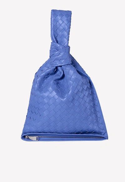 Shop Bottega Veneta The Twist Clutch In Intrecciato Lambskin In Blue