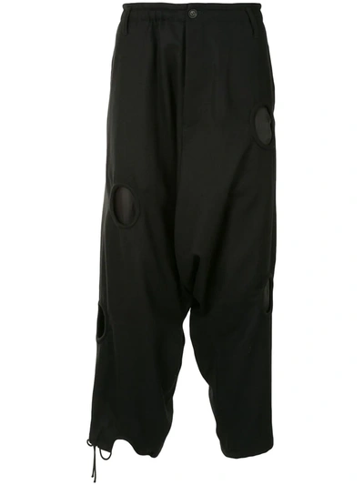 Shop Yohji Yamamoto Circle Cut-out Detail Loose Cropped Trousers In Black