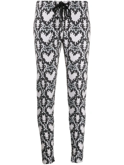 Shop Love Moschino Heart Print Tracksuit Trousers In Black