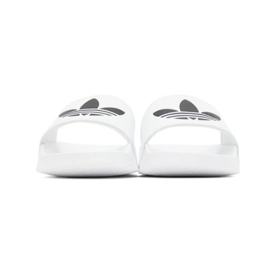 Shop Adidas Originals White Adilette Lite Pool Slides In Wht/blk