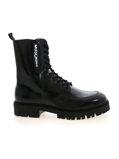 Shop Moschino Label Ankle Boots In Black