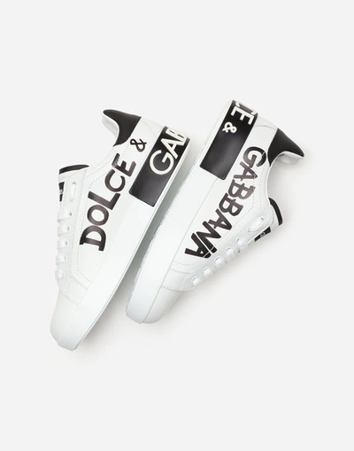 Shop Dolce & Gabbana Calfskin Nappa Portofino Sneakers With Lettering Print