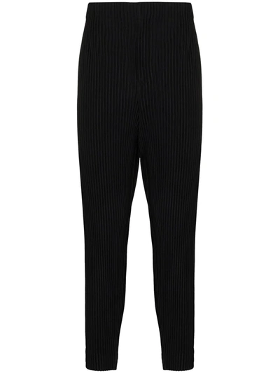 Shop Issey Miyake Plissé Tapered-leg Trousers In Black