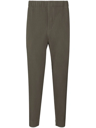 Shop Issey Miyake Tapered-leg Plissé Trousers In Green