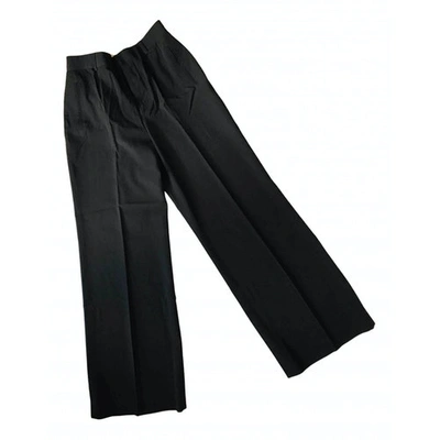 Pre-owned Jean Paul Gaultier Wool Large Trousers In Black