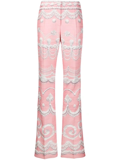 Shop Moschino Icing Print Flared Trousers In Pink