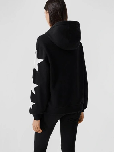 Shop Burberry Star Motif Cotton Oversized Hoodie In Black