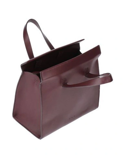 Shop Aesther Ekme Handbags In Maroon