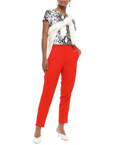 Shop Ganni Casual Pants In Orange