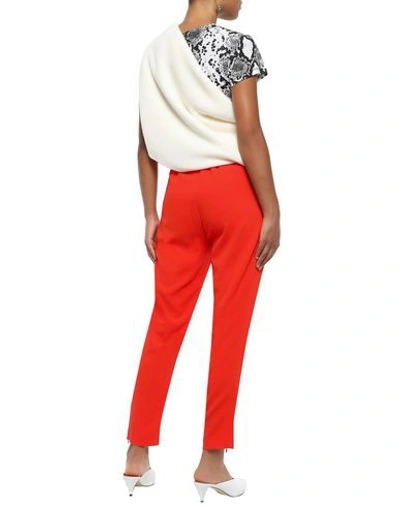 Shop Ganni Casual Pants In Orange