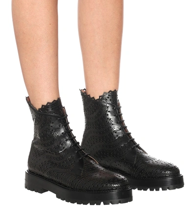 Shop Alaïa Laser-cut Leather Ankle Boots In Black