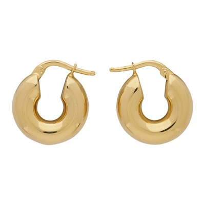 Shop Jil Sander Gold Hoop Earrings In 710 - Gold