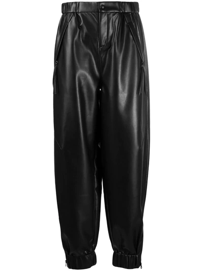 TAPERED FAUX LEATHER TROUSERS