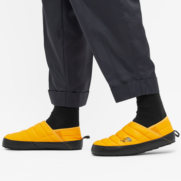 the north face thermoball traction v mule slippers in yellow