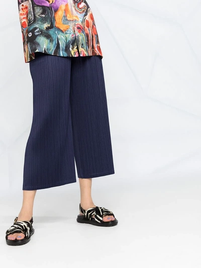 Shop Issey Miyake Micro-pleated Cropped Trousers In Blue