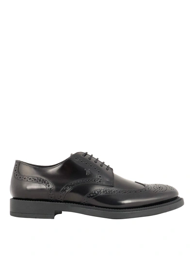 Shop Tod's Smooth Brogue Shoes In Black