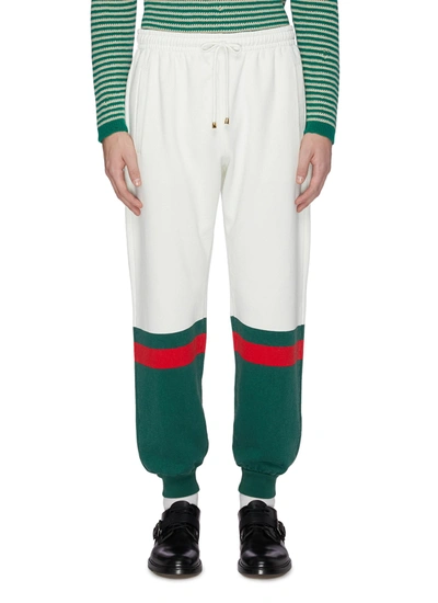 Shop Gucci Contrast Cuff Jogging Pants In White,green