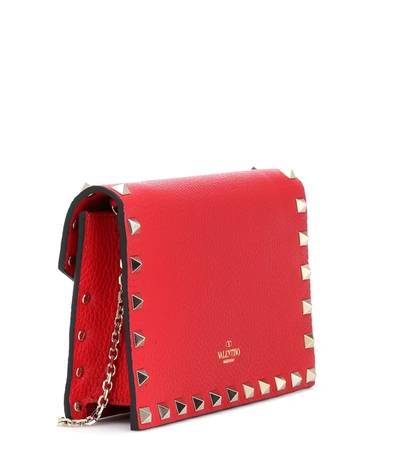 Shop Valentino Rockstud Small Leather Clutch In Red