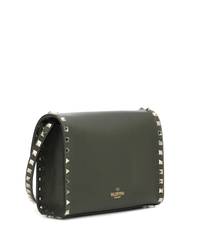 Shop Valentino Rockstud Small Leather Clutch In Green