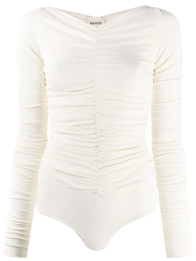 Shop Khaite Long Sleeved Ruched Bodysuit In White