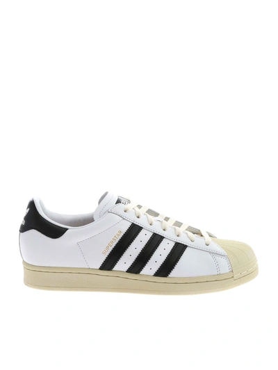 Shop Adidas Originals Superstar Sneakers In White And Black