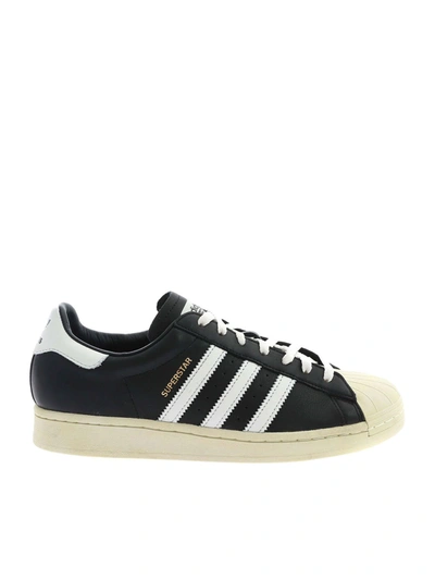 Shop Adidas Originals Superstar Sneakers In Black And White