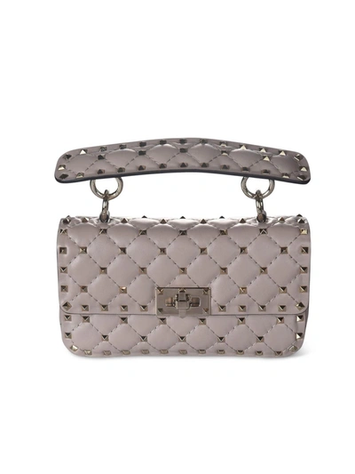 Shop Valentino Small Rockstud Spike Bag In Powder Color In Pink