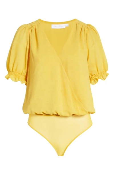 Shop All In Favor Surplice Bodysuit In Mellow Yellow