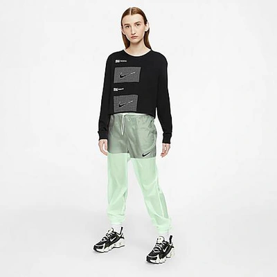 Shop Nike Women's Sportswear Indio Woven Jogger Pants In Cucumber Calm/black/black