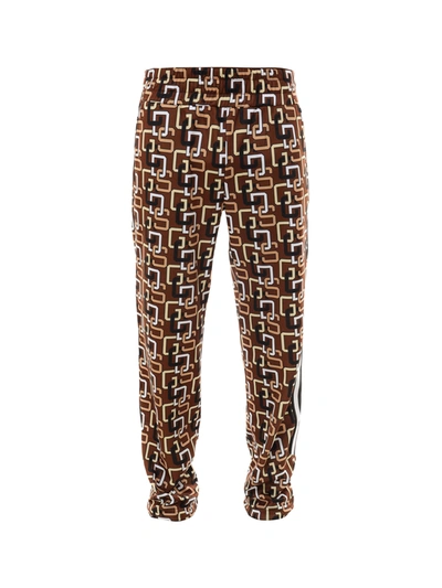 Shop Gcds Trousers In Brown