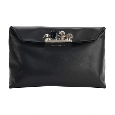 Shop Alexander Mcqueen Four Ring Clutch In Black