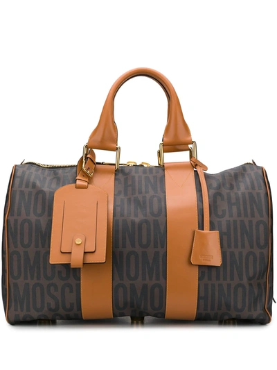 Shop Moschino Logo Print Holdall In Brown