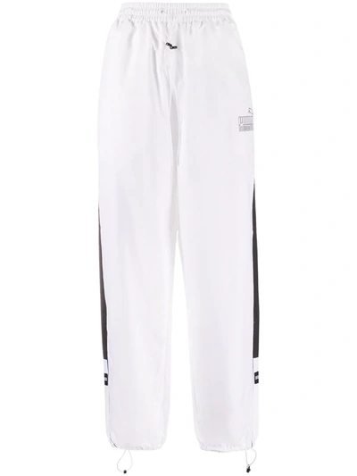 Shop Puma Loose Fit Track Pants In White