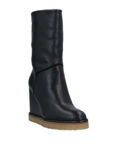 Shop Celine Boots In Black