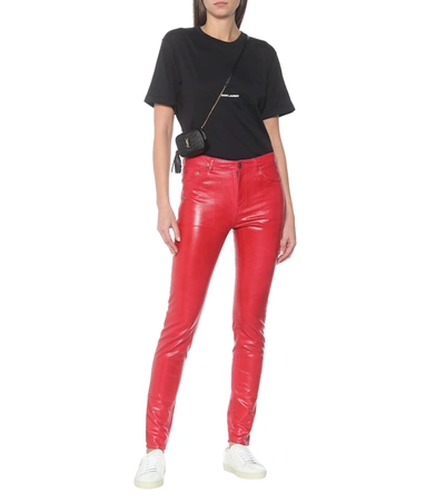 Shop Saint Laurent Mid-rise Skinny Coated Cotton Jeans In Red
