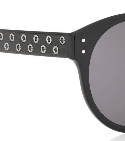 Shop Alaïa Round Sunglasses In Black