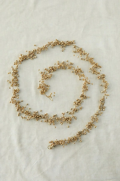 Shop Anthropologie Jingle Bell Garland In Gold