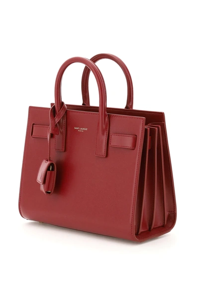 Shop Saint Laurent Nano Sac De Jour Handbag In Red