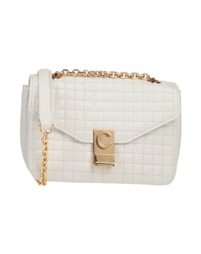 Shop Celine Handbags In White