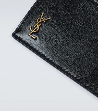 Shop Saint Laurent Tiny Cassandre Fragments Leather Card Holder In Black