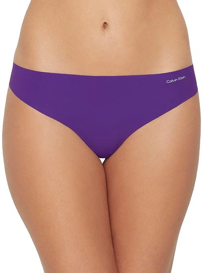 Shop Calvin Klein Invisibles Thong In Rich Violet