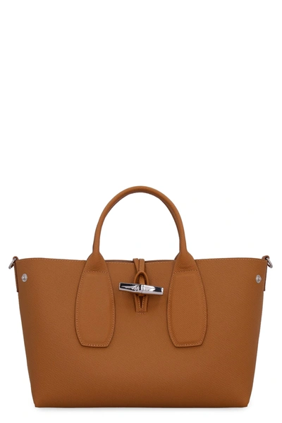Shop Longchamp Roseau Pebbled Leather Handbag In Camel