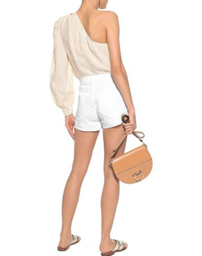 Shop Frame Denim Shorts In White