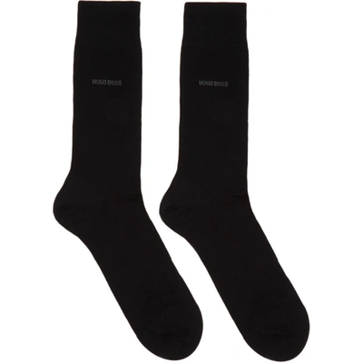 Shop Hugo Boss Boss Two-pack Black All Over Logo Socks In 001 Black