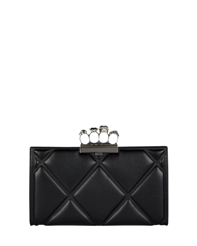 Shop Alexander Mcqueen Skull Four Ring Quilted Clutch In Black