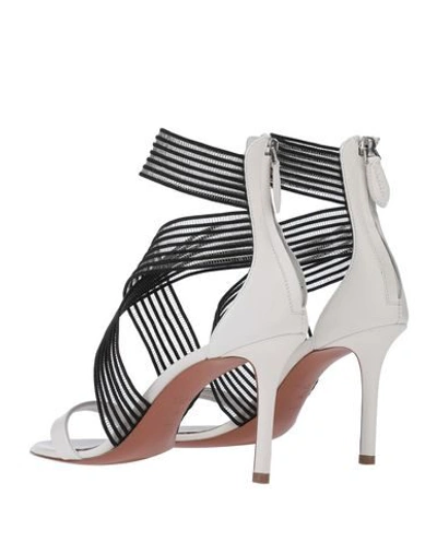 Shop Alaïa Sandals In White