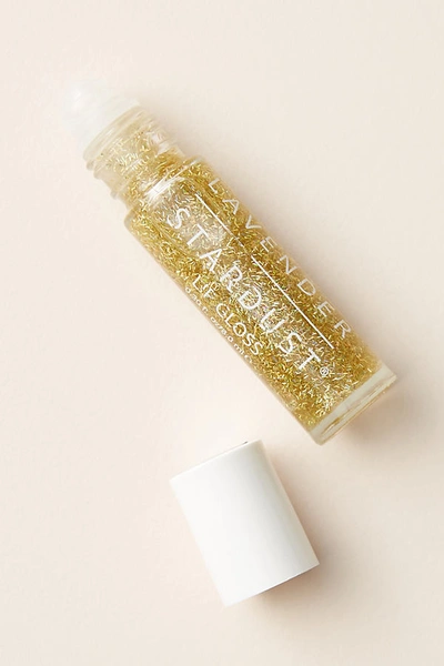 Shop Lavender Stardust Glitter Lip Gloss In Gold