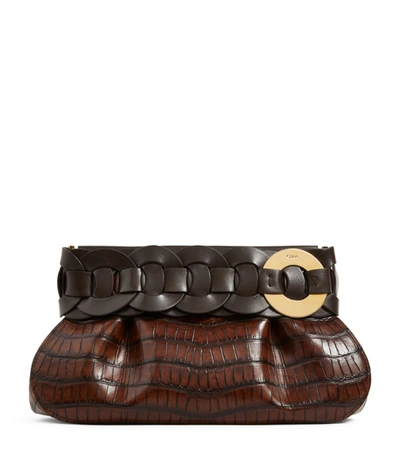 Shop Chloé Leather Croc-embossed Darryl Clutch Bag